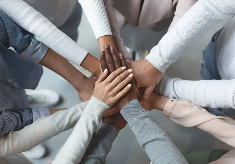 all_hands_in_for_a_huddle_for_unity_by_prostock-studio_gettyimages